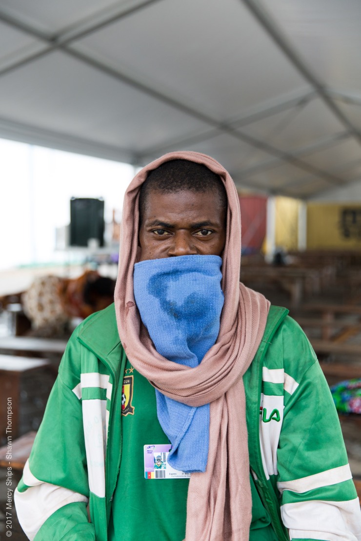 Ernest, Maxillofacial patient, waiting in the tent during screening.