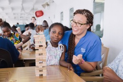 Hannah Thyberg, Pediatric Ward Nurse, playing Jenga with some of the patients on Deck 7.